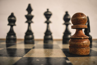 Close-up of chess pieces on table