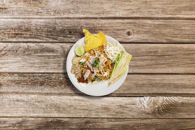 High angle view of chopped vegetables in bowl on table