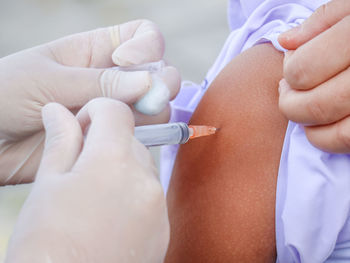 Cropped hand of doctor examining patient