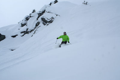 Man skiing on snowcapped mountain