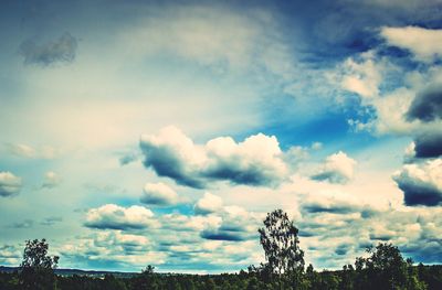 Scenic view of landscape against cloudy sky