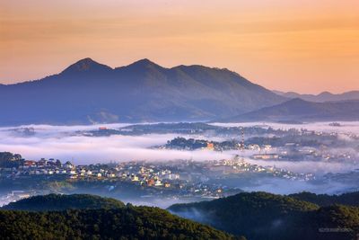 High angle view of mountains against sky during sunset