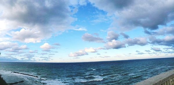 Scenic view of calm sea against blue sky