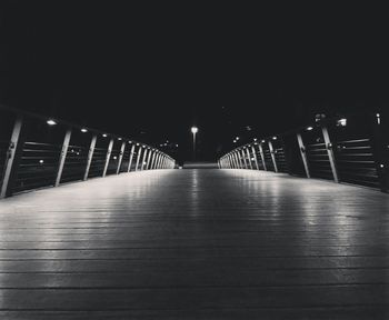 Illuminated bridge at night