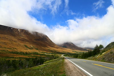 Scenic view of mountain road against sky