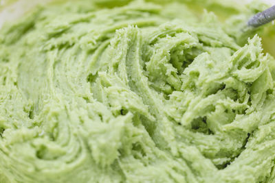 Close up on green cookie dough. spring holidays cooking concept.