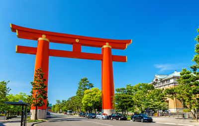 View of red temple against clear blue sky