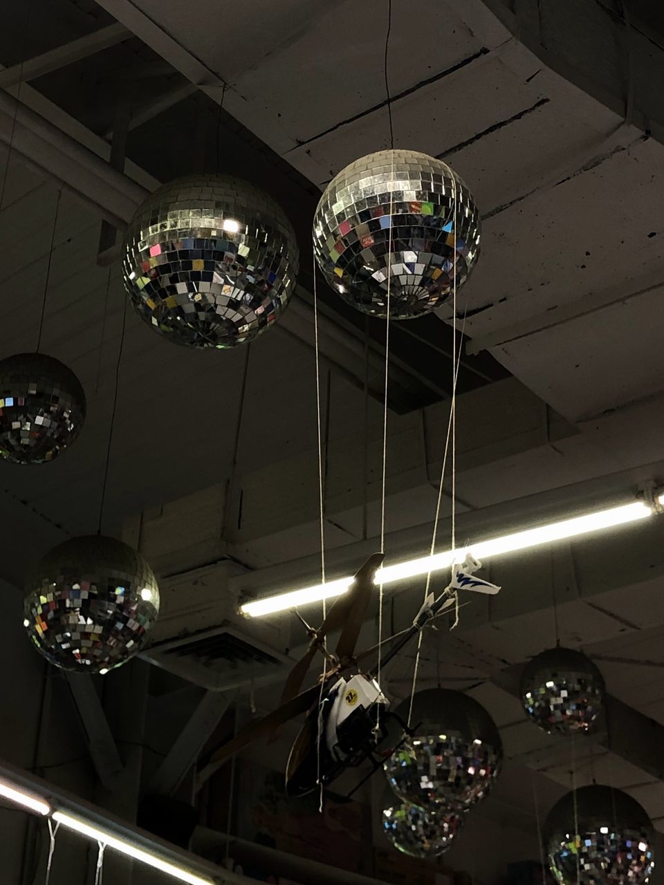 light, ceiling, hanging, disco ball, lighting, lighting equipment, indoors, low angle view, chandelier, no people, decoration, illuminated, arts culture and entertainment, night, pendant light, architecture