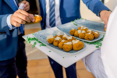 Midsection of man preparing food