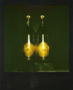 Close-up of illuminated bottles on table