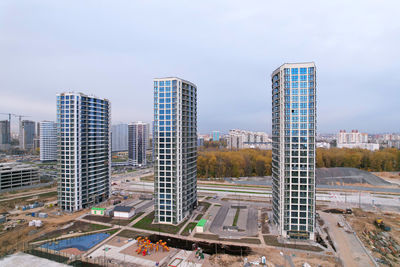 High angle view of buildings in city against sky