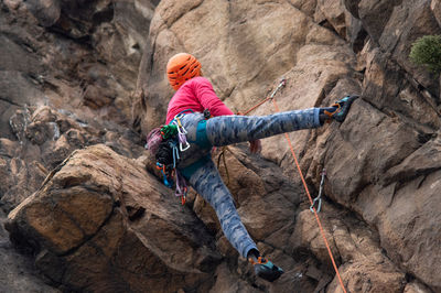 Low section of people on rock