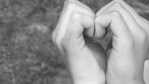 Close-up of hands holding baby feet