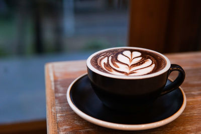 Close-up of cappuccino on table