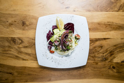 High angle view of fruit salad in plate on table