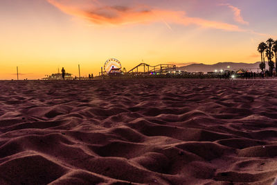 View of amusement park at sunset