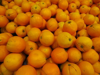 Full frame shot of oranges at market stall