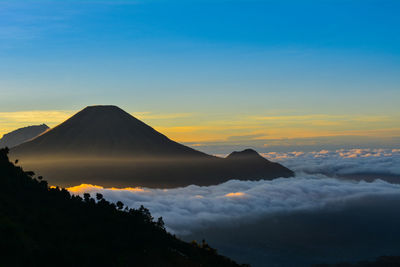 The view from the top of mount prau and the activities of the climbers near the camping tent