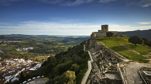 High angle view of old ruins against sky