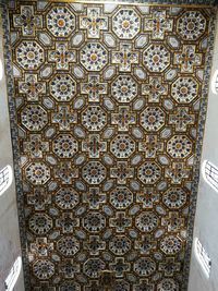 Low angle view of patterned wall in building