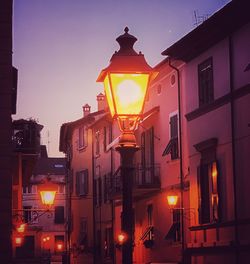 Low angle view of illuminated street light at night