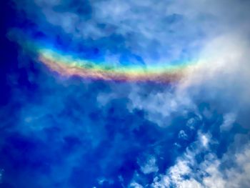 Low angle view of rainbow in sky