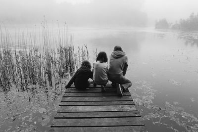 Rear view of people on jetty