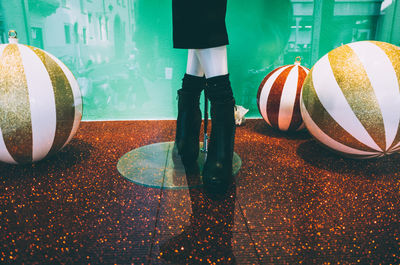 Low section of woman standing on tiled floor