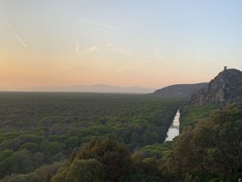 Scenic view of landscape against sky during sunset