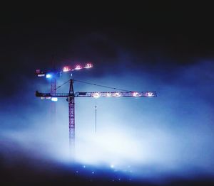 Low angle view of illuminated building against sky
