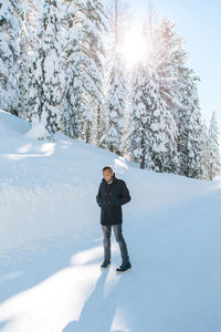 Full length of man on snow covered mountain
