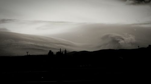 Scenic view of mountains against sky at sunset