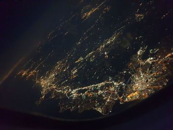 Low angle view of illuminated fireworks against sky at night