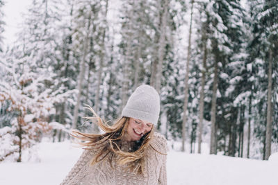 Portrait of a smiling woman in snow