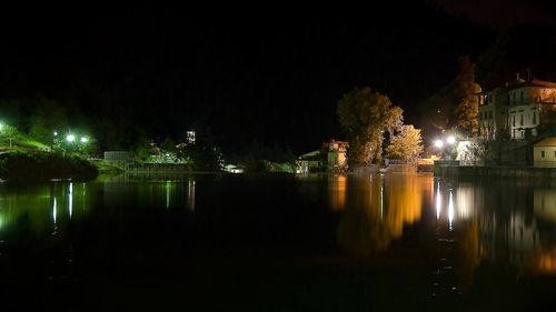 Reflection of illuminated lights in puddle