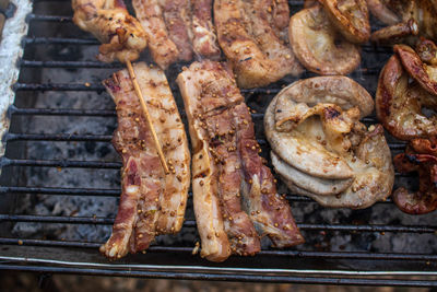 High angle view of meat on barbecue grill