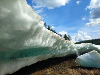 Scenic view of frozen lake against sky