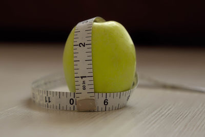 Close-up of green apple on table