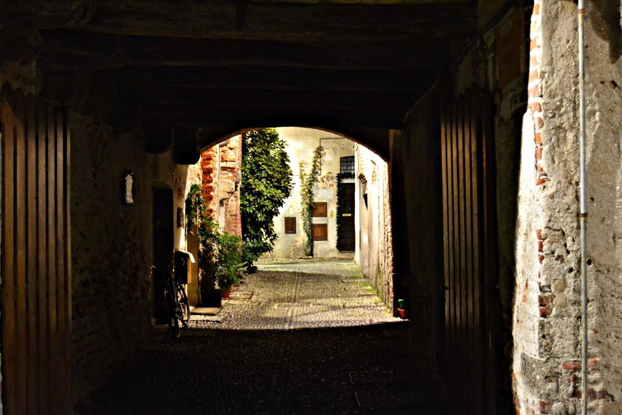 architecture, built structure, the way forward, indoors, arch, building exterior, diminishing perspective, archway, narrow, corridor, building, door, old, vanishing point, wall - building feature, house, day, abandoned, tunnel, no people