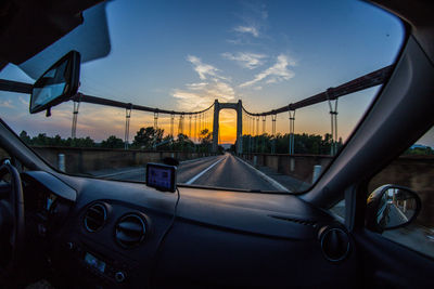 Cars on road against sky