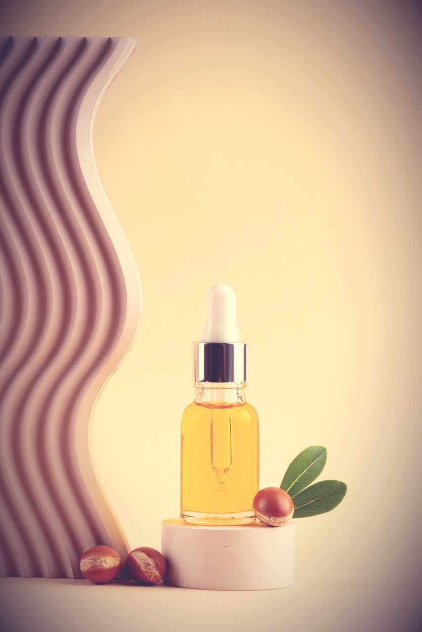 bottle, personal care, perfume, container, skin, food, wellbeing, aromatherapy, therapy, food and drink, no people, indoors, skin care, nature, beauty product, cosmetics, body care, copy space, plant, still life, yellow, scented, studio shot