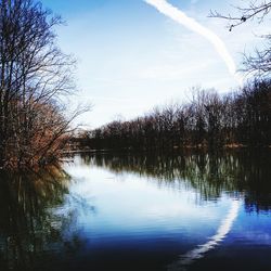 Scenic view of lake against sky at sunset