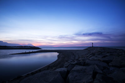 Scenic view of sea against sky at sunset