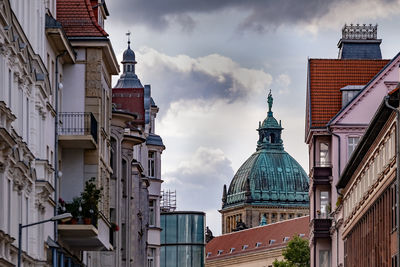 Buildings in city against sky