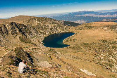 Rear view of man looking at mountains