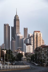 Modern buildings in city against sky