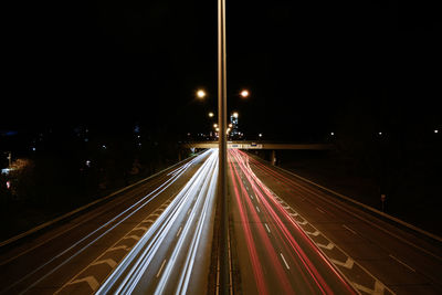 High angle view of light trails on road at night