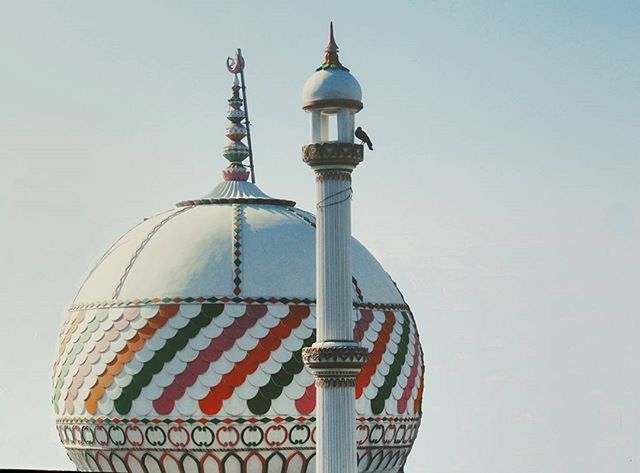 low angle view, clear sky, built structure, architecture, lighting equipment, building exterior, sky, high section, street light, dome, religion, place of worship, day, outdoors, protection, spirituality, copy space, no people, tower, travel