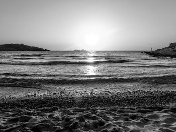 Scenic view of beach against clear sky