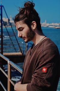 Young man looking at sea